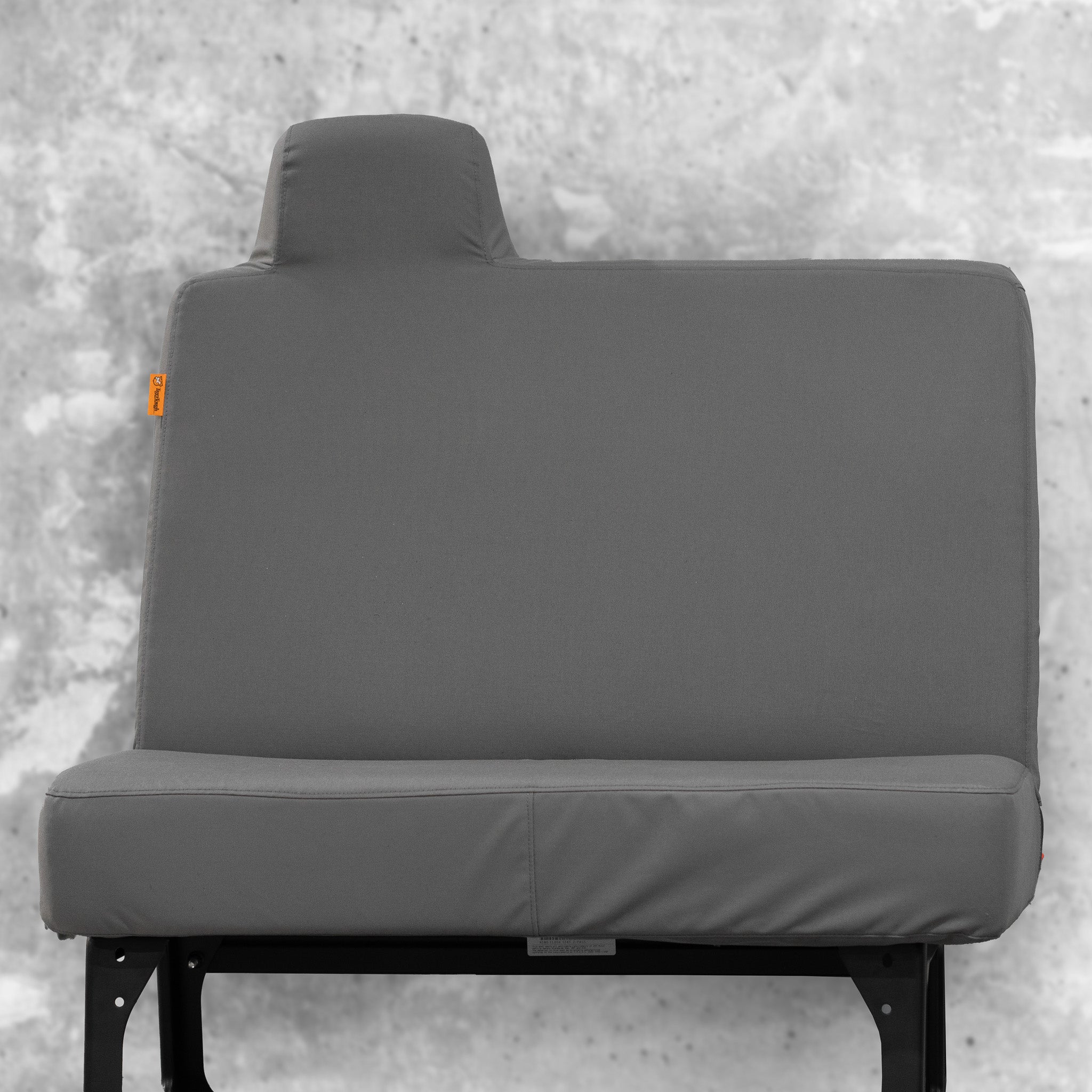 TigerTough's heavy duty, nearly indestructible seat cover for a Hino passenger bench