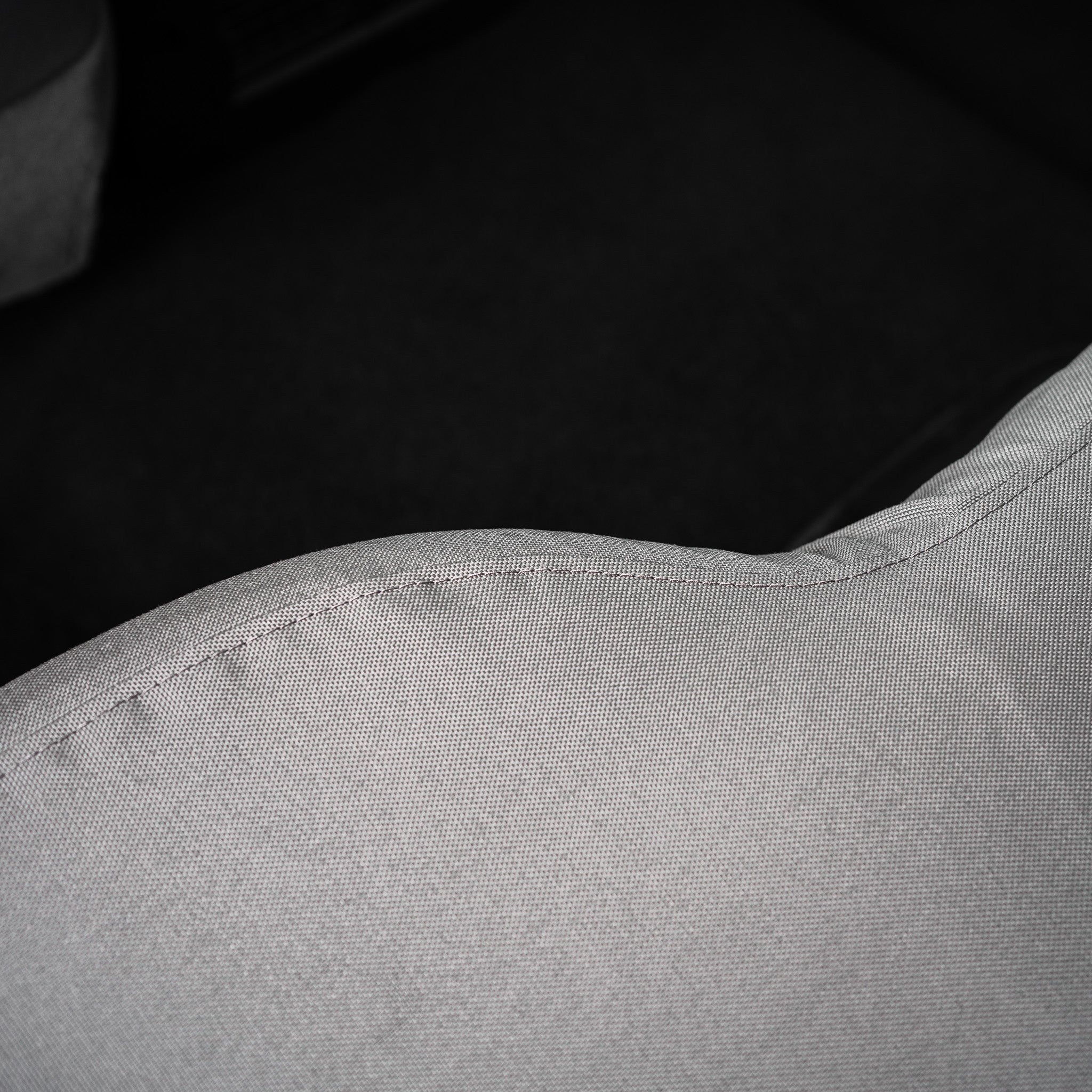 Detail photo showing a seam on this TigerTough cover for a RAM full bench seat. Every single stitch happens right here in America.