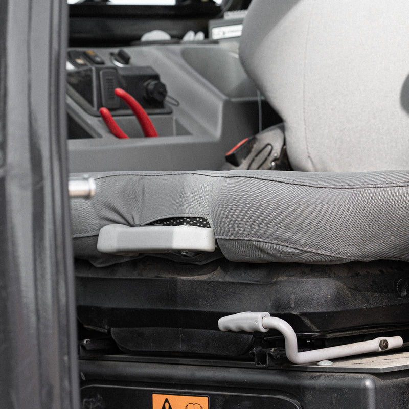 This picture shows how the TigerTough Seat Cover works around the existing seat features like the lever on the front of the seat.