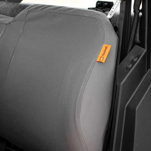 A close-up of the side of a UTV/ATV seat with TigerTough seat covers installed.