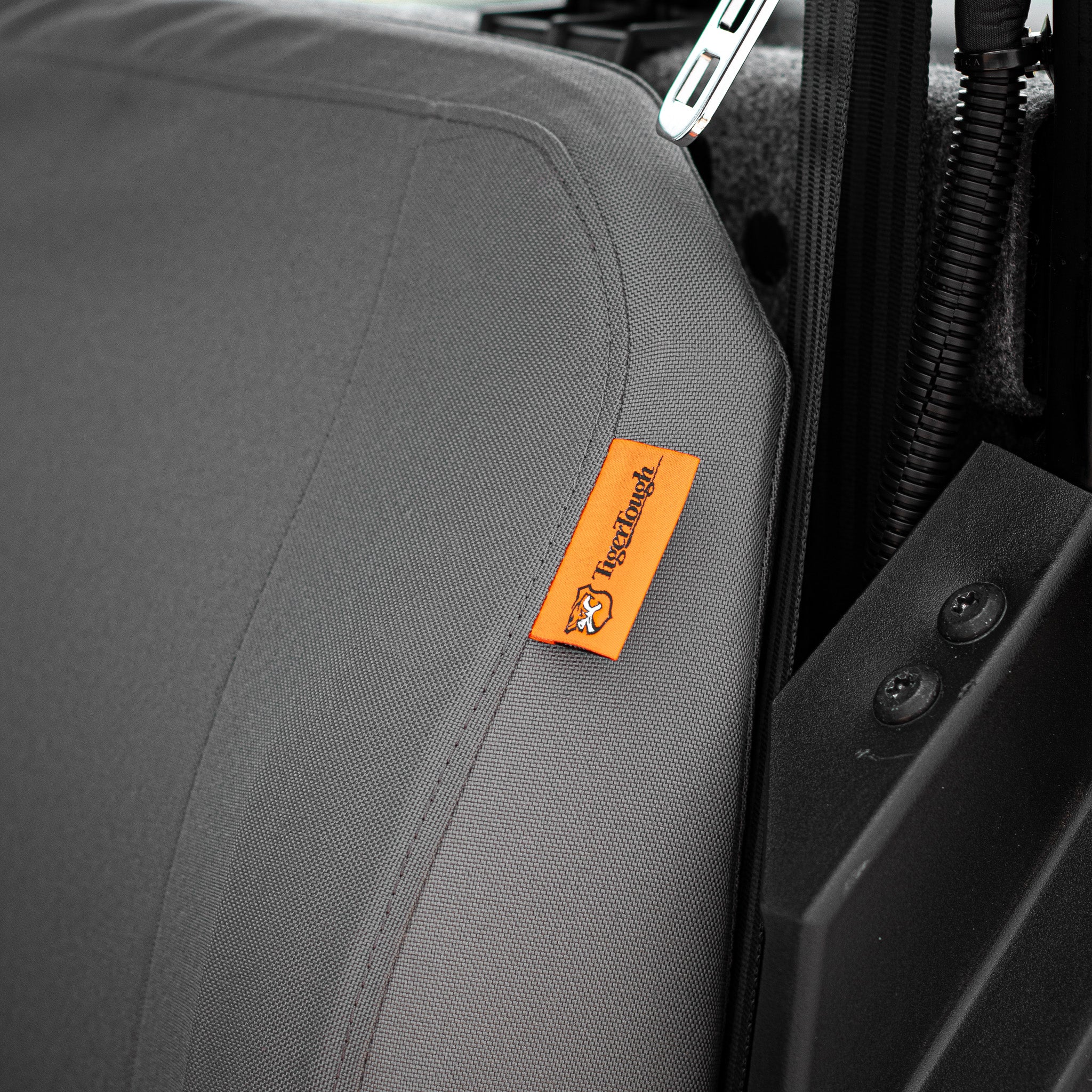 A close-up of the TigerTough tag on the side of the seat cover. 