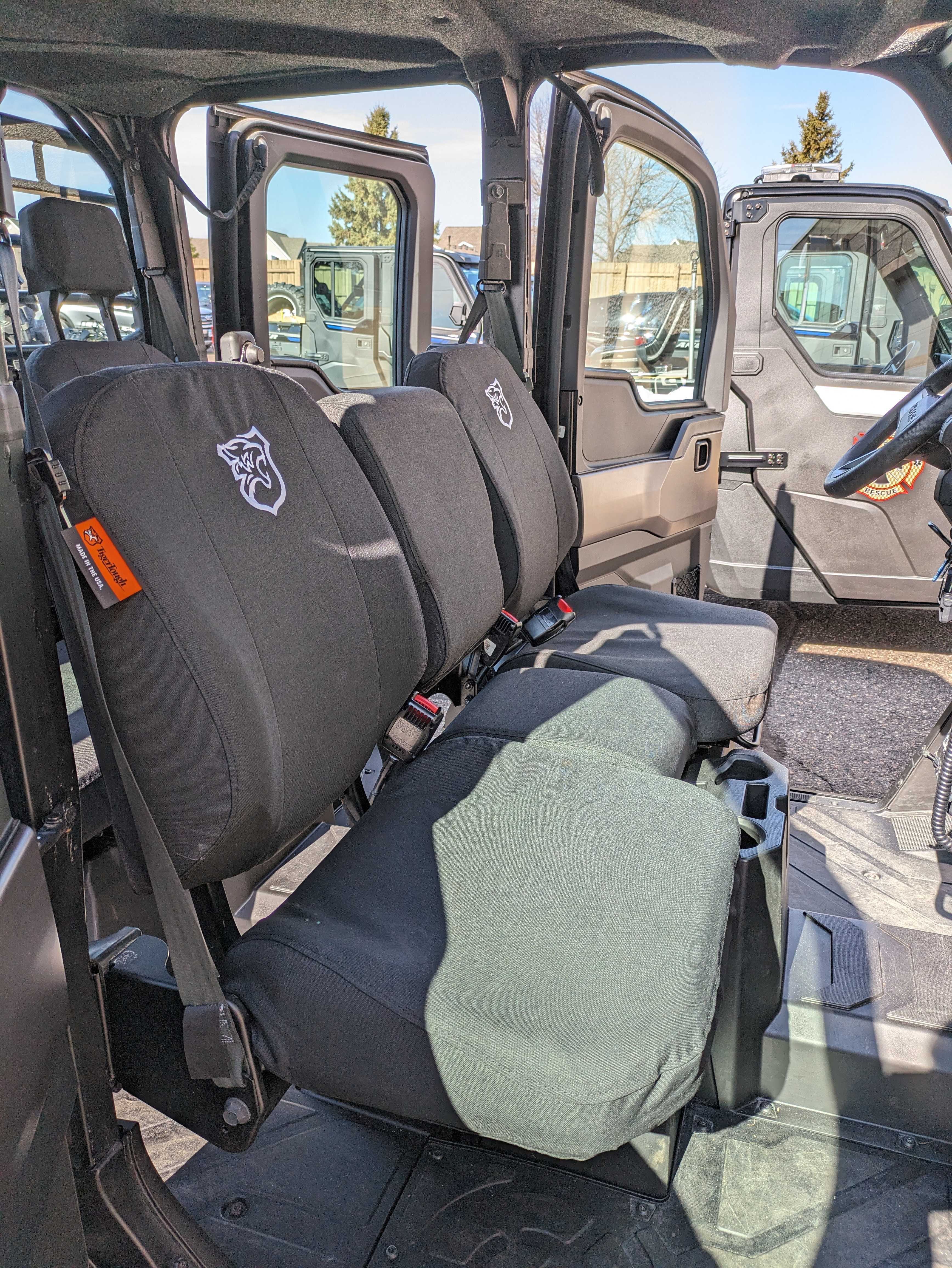 TigerTough Seat Covers in a Polaris Ranger side-by-side. TigerTough has seat covers for common side-by-sides, ATVs, and UTVs to protect their seats from the elements and the wear and tear of hard use.