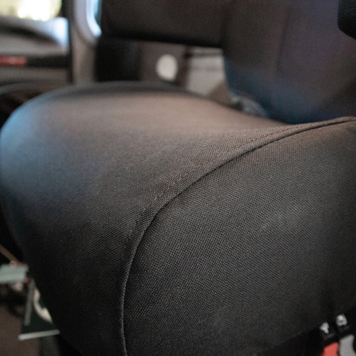 National Air Ride Seat with dual armrests and black IronWeave TigerTough Seat Covers