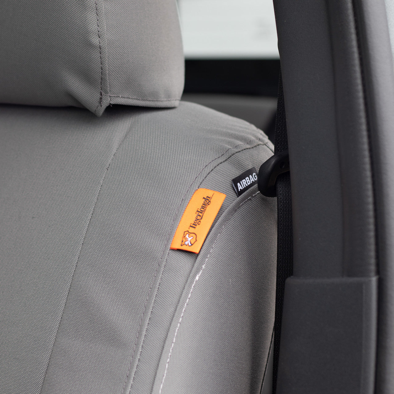 TigerTough Nissan Titan Heavy Duty Front Seat Covers - Headrest Detail and Airbag compatible patch, because safety first.