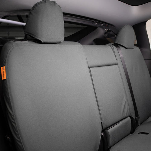 TigerTough Tactical Seat Covers on the rear seat of a Tesla Model Y