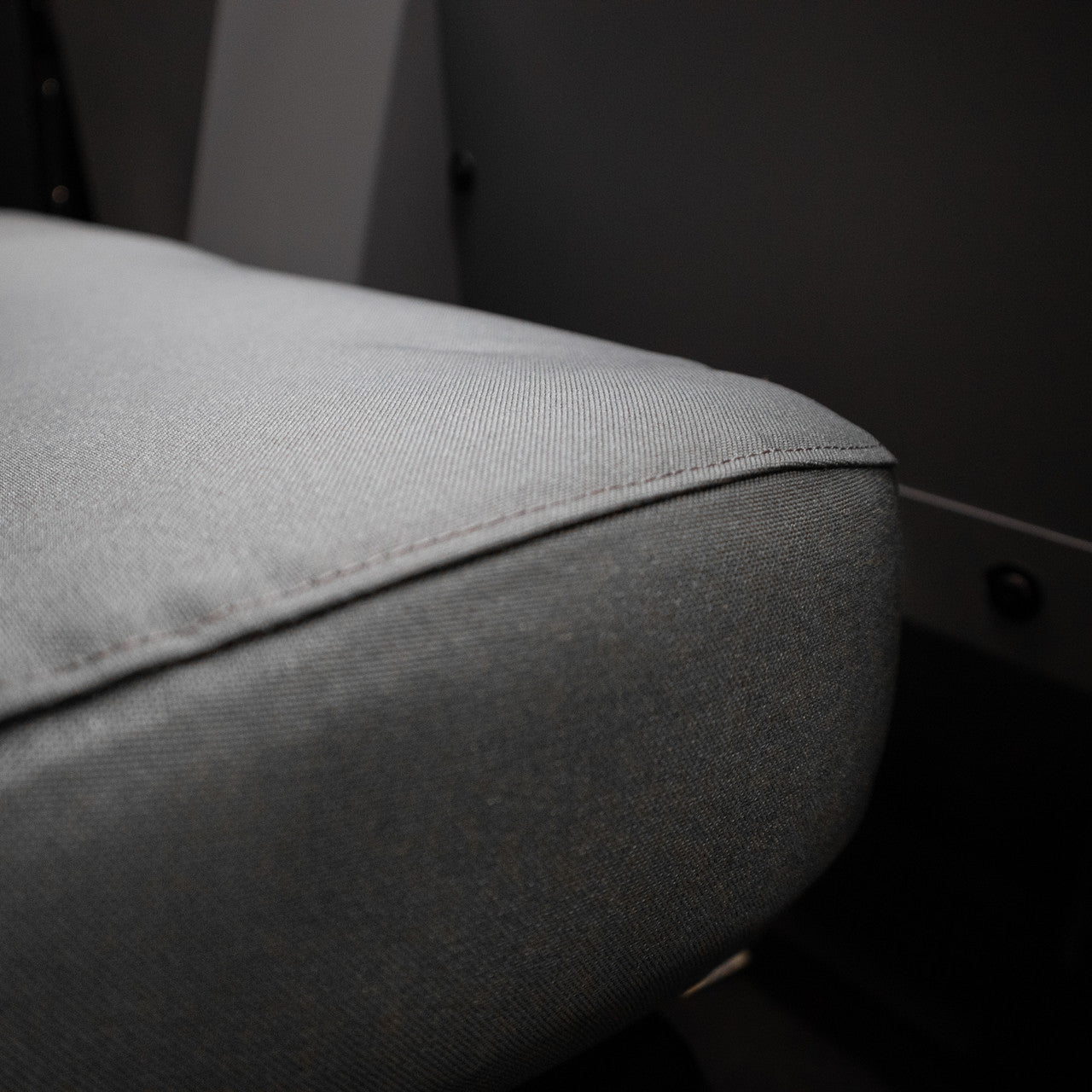 TigerTough Tactical Seat Covers on the rear seat of a Tesla Model Y - Seat Edge Detail