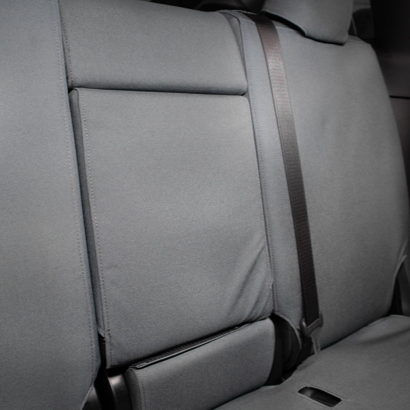 TigerTough Tactical Seat Covers on the rear seat of a Tesla Model Y - Folding Armrest Detail