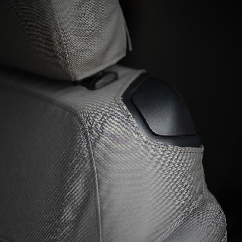 This cover allows access to the handle on the corner of the seat so that you can easily fold your seat forward