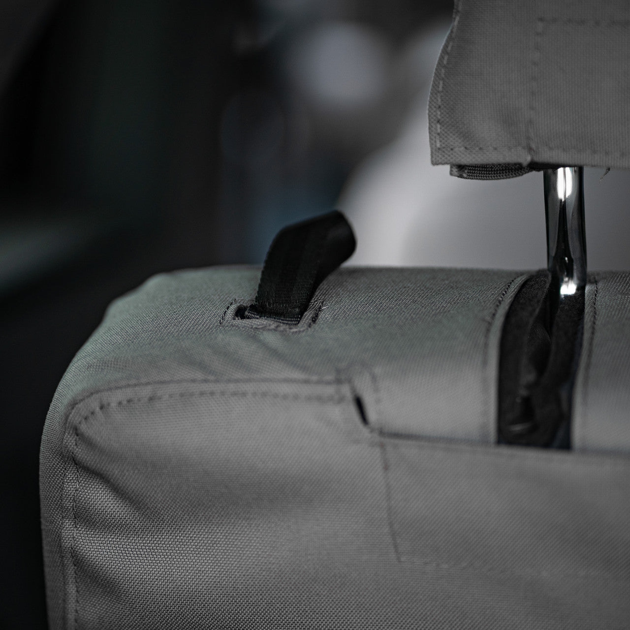 Seat back detail showing the adjustment strap