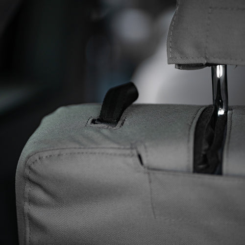Seat back detail showing the adjustment strap