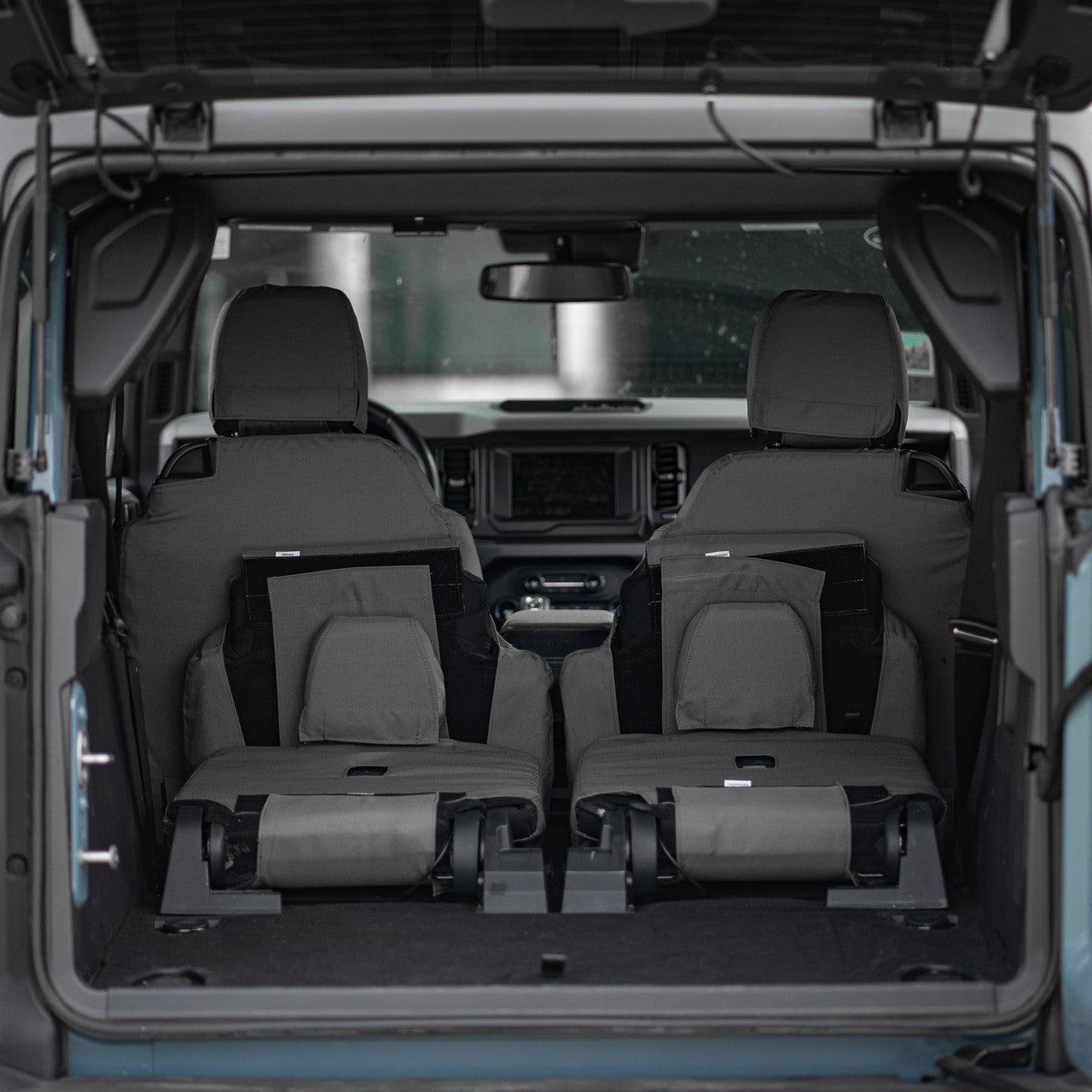 Photo of TigerTough Seat Covers on the Ford Bronco rear seat with the seats folded flat