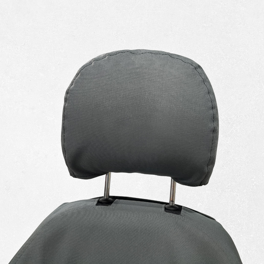 Komatsu/Deere Excavator with gray TigerTough seat cover, showing headrest