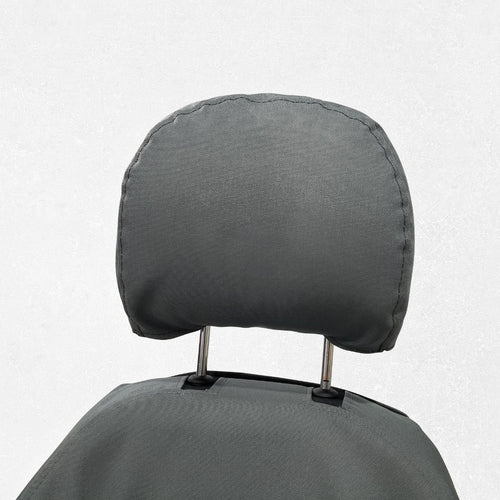 Komatsu/Deere Excavator with gray TigerTough seat cover, showing headrest