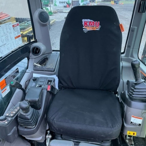 Kubota excavator with black TigerTough seat cover and custom embroidery