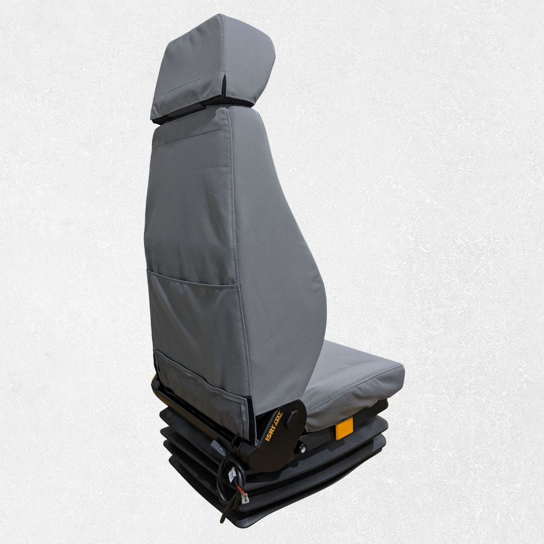 Rear and right side of Komatsu wheel loader seat with gray TigerTough seat cover