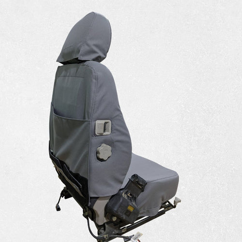 Komatsu dozer seat with gray TigerTough seat cover, side switch detail