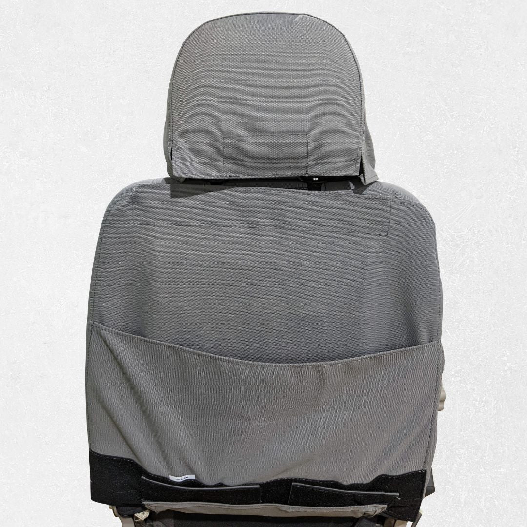 Komatsu dozer seat with gray TigerTough seat cover, back pocket detail