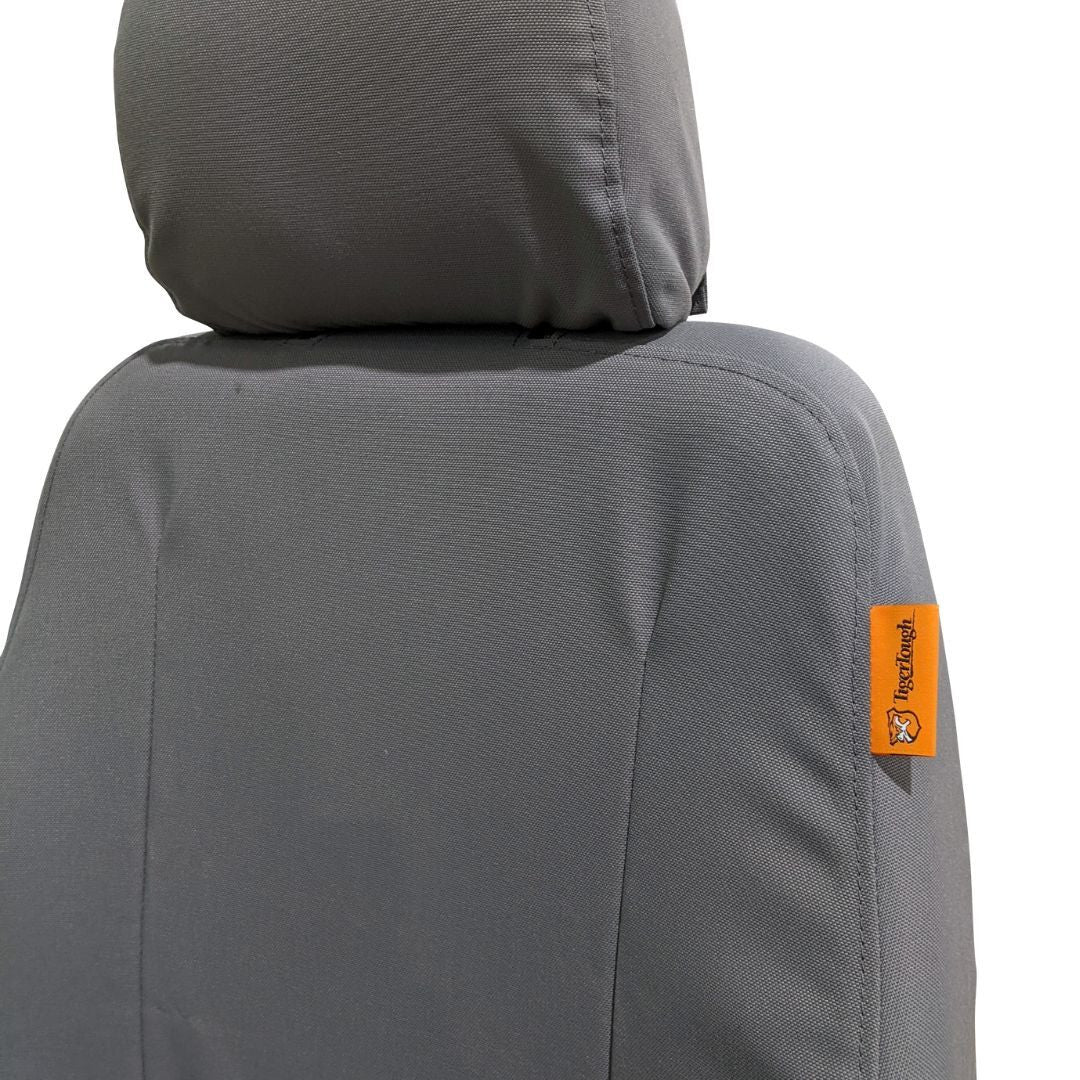 Komatsu dozer seat with gray TigerTough seat cover, headrest detail