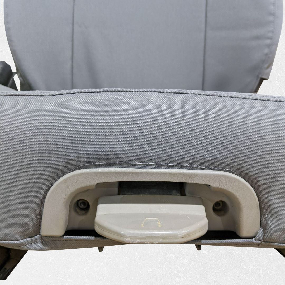 Komatsu dozer seat with gray TigerTough seat cover, seat bottom lever detail