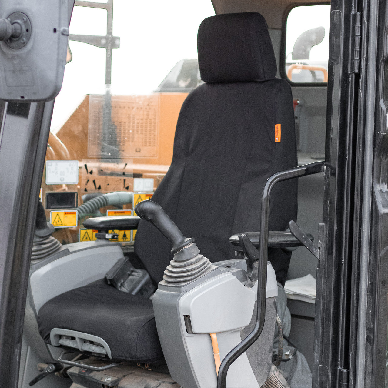 TigerTough seat cover for a CAT excavator