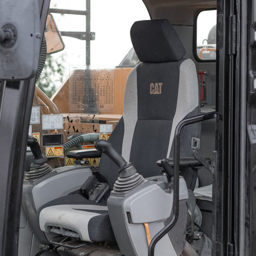 The original seat in the CAT excavator.