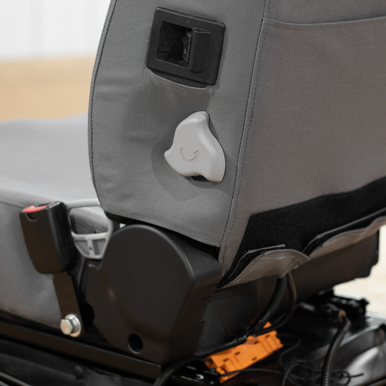 This Case & Link-Belt Excavator Seat Cover works with the existing seat controls