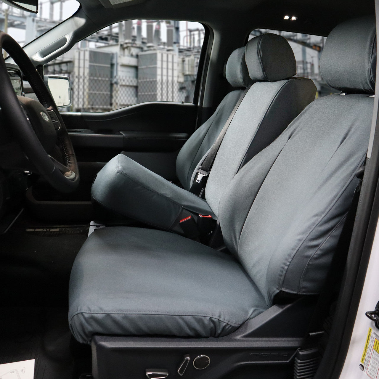 2021 Ford F150 with gray TigerTough seat covers, console bottom open.