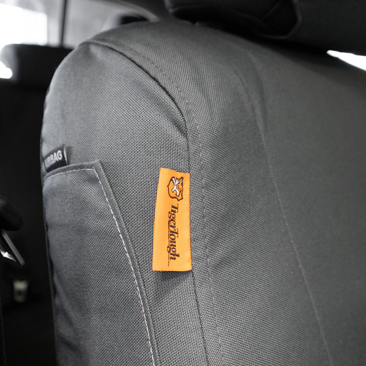 TigerTough Gray Seat Covers on a Toyota Tacoma Airbag Patch Detail