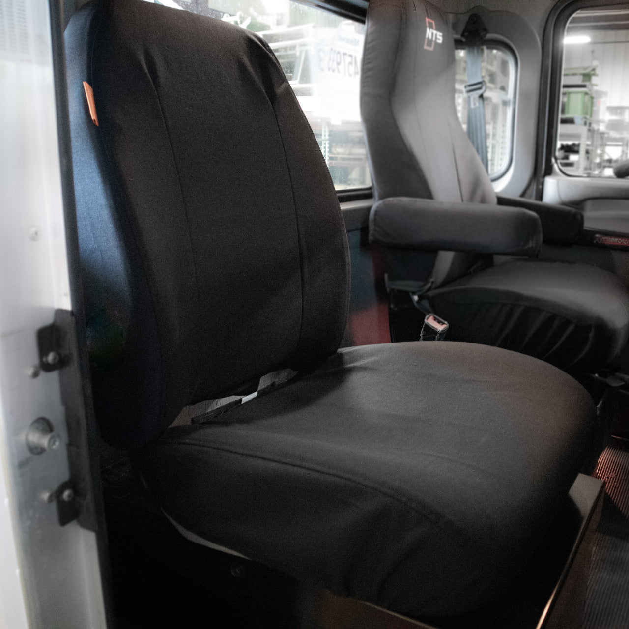 Kenworth passenger seat with TigerTough seat cover in black IronWeave