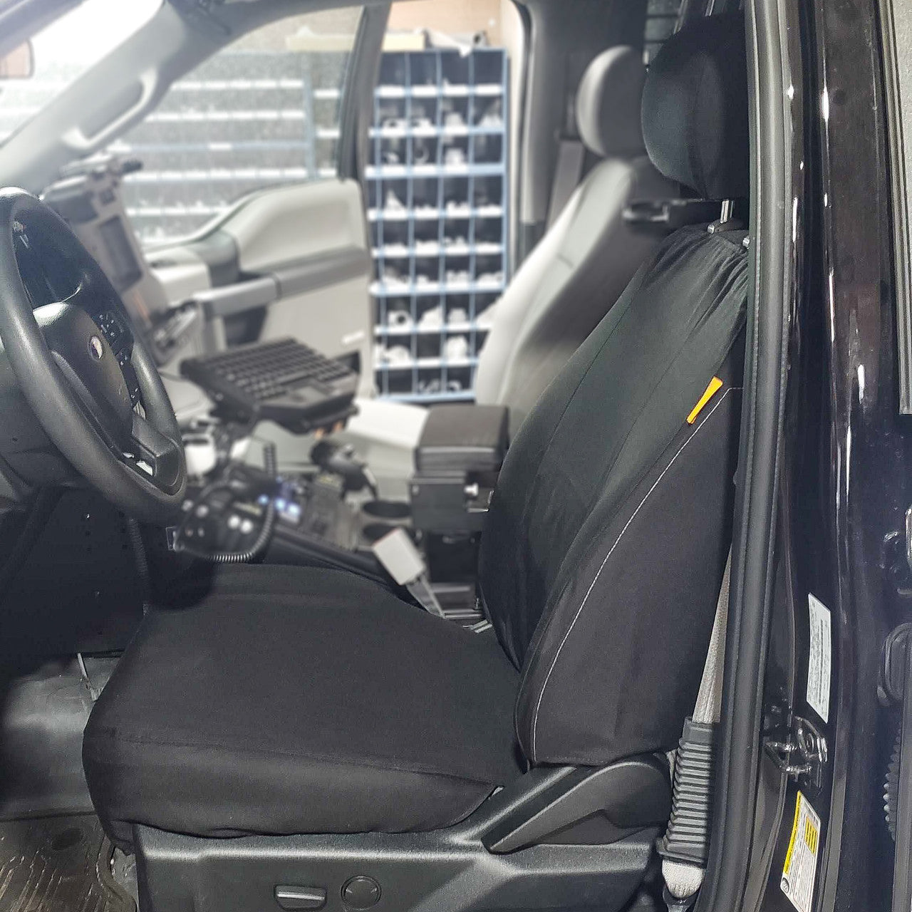 Ford Police F150 with black TigerTough seat covers.