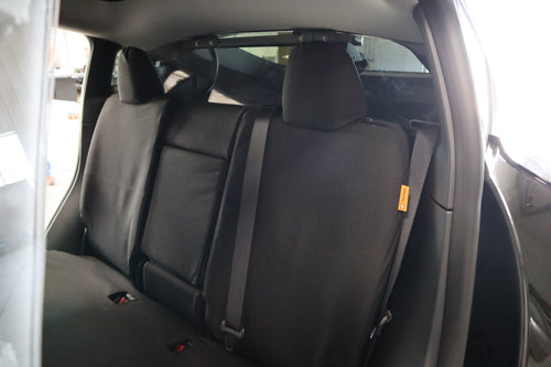 TigerTough Tactical Seat Covers on the rear seat of a Tesla Model Y